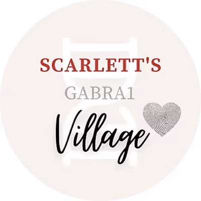 Logo with text Scarlett's Gabra1 Village and a heart-shaped fingerprint on light circular background.